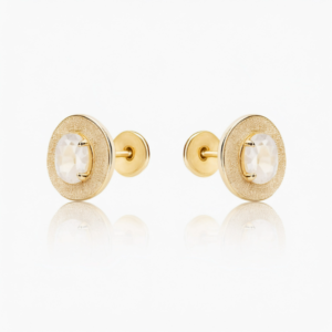 A pair of gold plated flat back earrings with a circular design and sparkling crystal, perfect for helix and cartilage piercings.