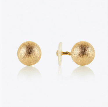 A pair of classic gold ball flat back earrings made from 14k gold, featuring a smooth, polished finish and a secure flat back design for comfortable wear. Ideal for helix and cartilage piercings, these minimalist stud earrings offer a timeless and elegant look.