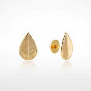 A pair of 14k gold leaf shaped flat back earrings with delicate textured detailing, perfect for helix and cartilage piercings.