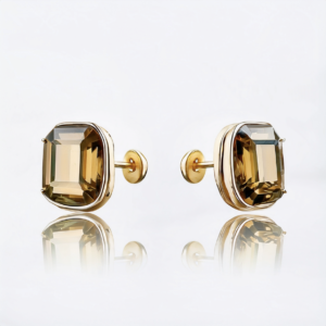 A pair of gold plated flat back earrings featuring bright topaz crystals, designed for helix and cartilage piercings.